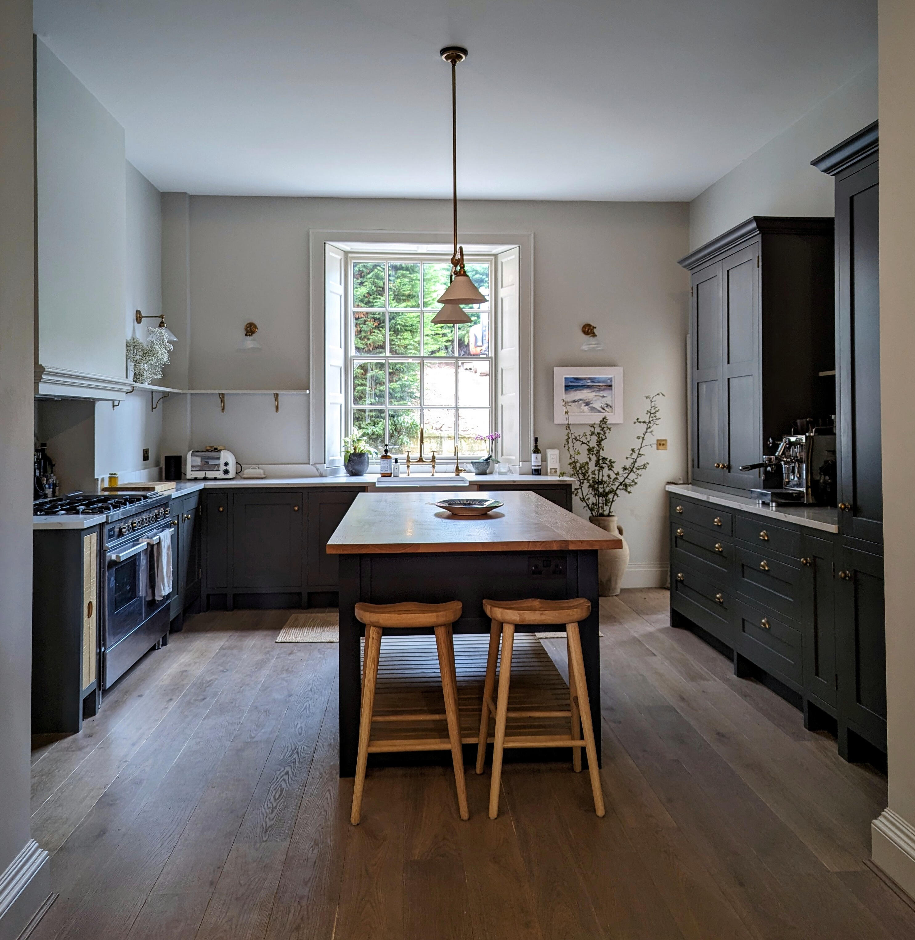 Shaker kitchen In frame shaker kitchen, solid maple painted in little greene with freestanding island and brass hardware