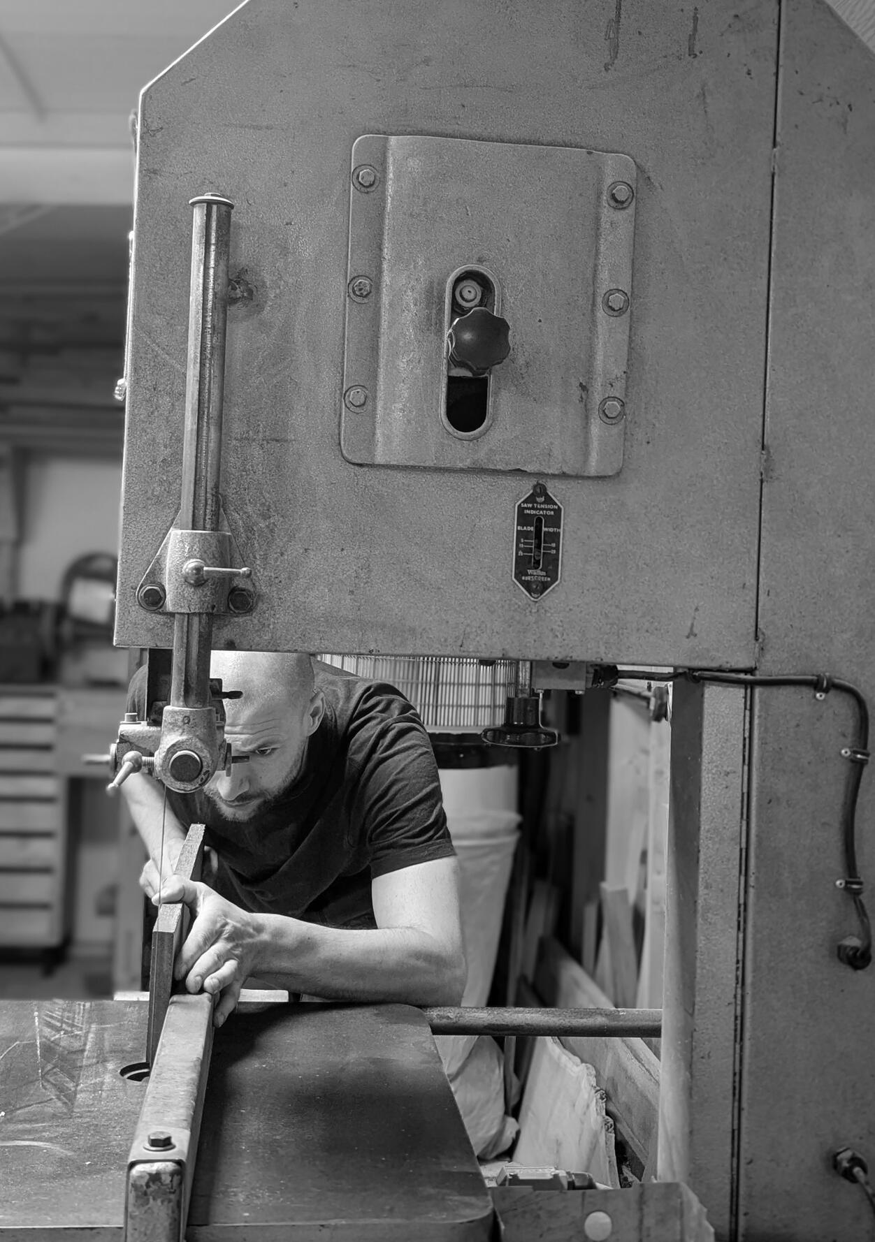 Shaker kitchen Joshua Howard using a bandsaw to machine timber in his Yorkshire workshop