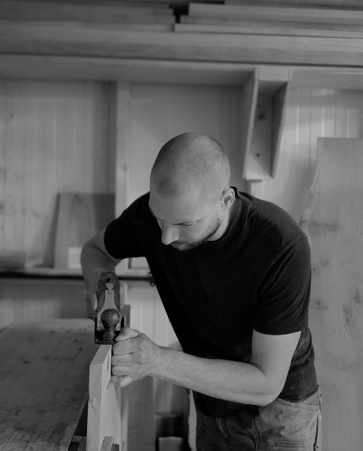 Shaker kitchen Joshua howard hand planing a door in his Leeds based workshop