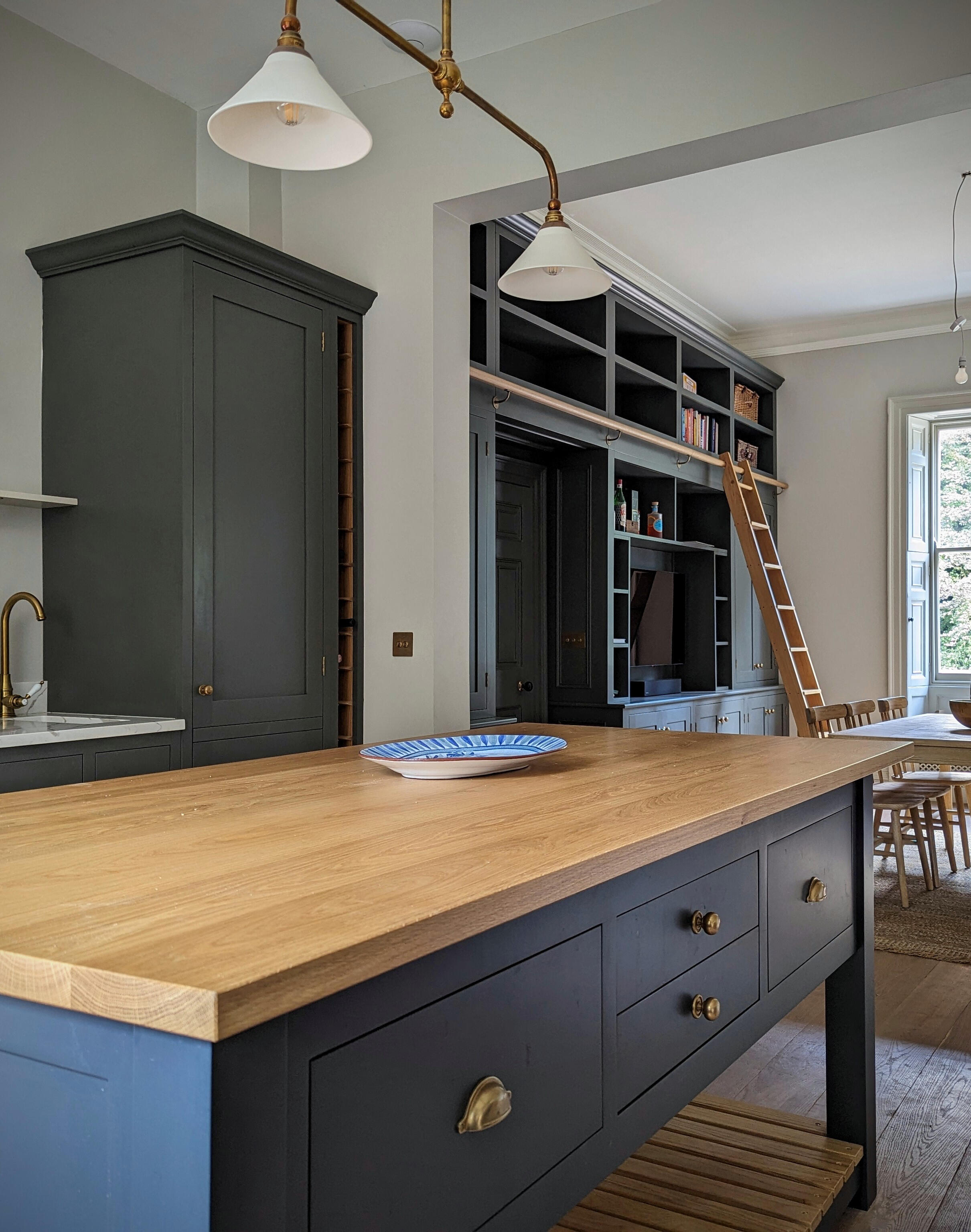 Shaker kitchen Bespoke library ladder and bookcases painted in little greene pompeian ash. With freestanding island
