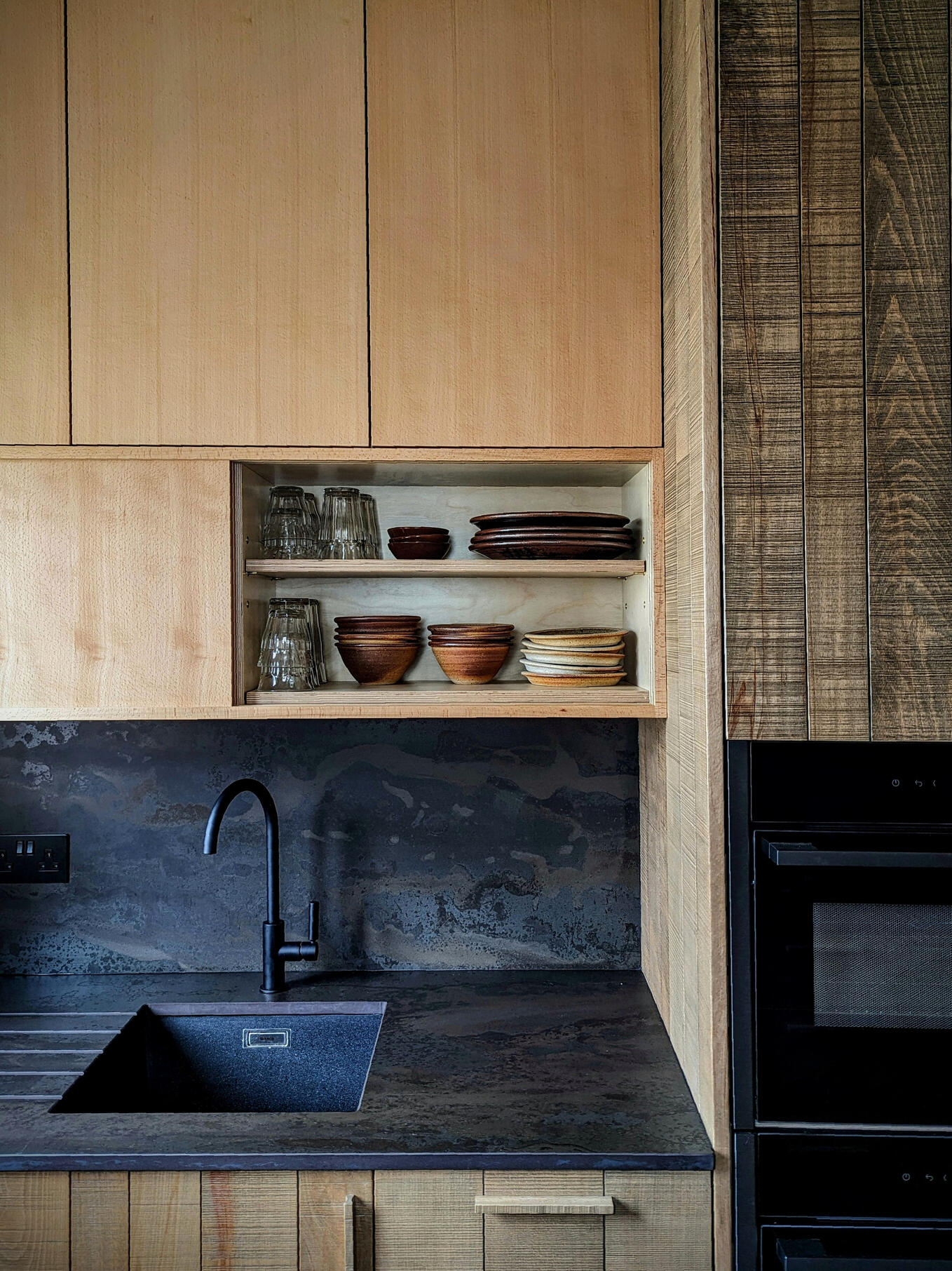 Shaker kitchen Beech veneered wall cabinet with sliding door and solid bandsawn textured doors. Handmade by Joshua howard joinery, fitted in wetherby
