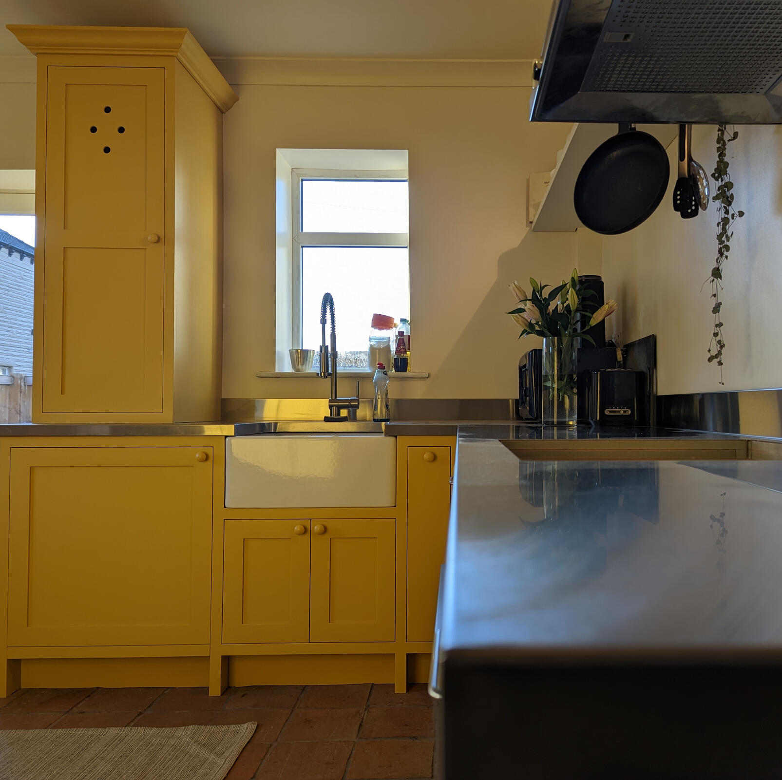 Shaker kitchen Yellow shaker kitchen with stainless steel worktop. Built by Joshua howard joinery. Fitted in horbury